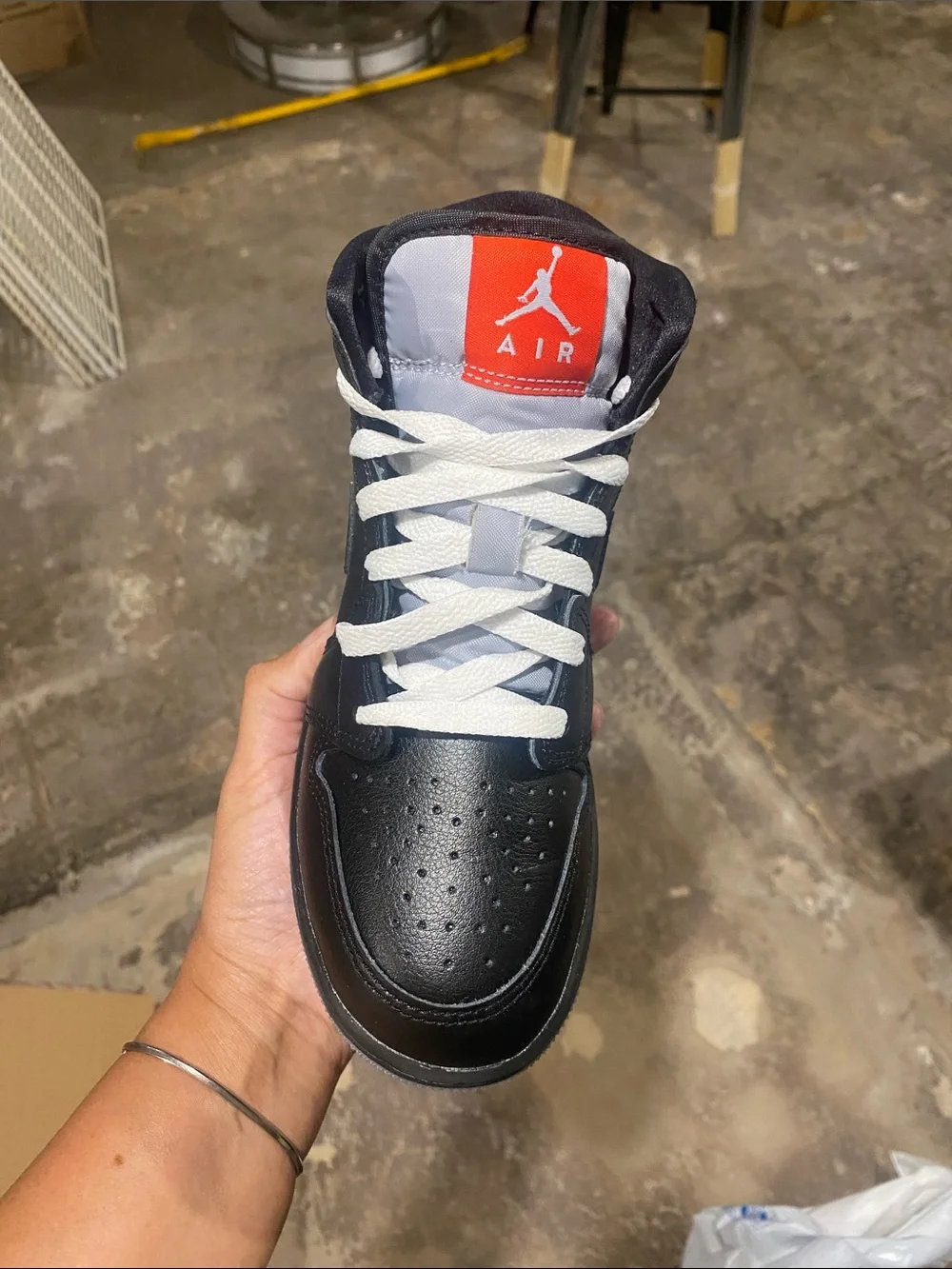 Nike Air Jordan 1 Mid - Black with White Laces and Red Tongue